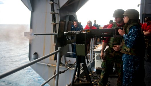 Flickr - Official U.S. Navy Imagery - A Sailor fires a machine gun. (2)