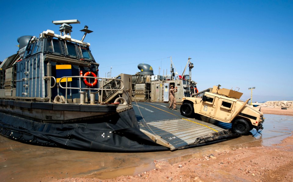 Flickr - Official U.S. Navy Imagery - A Sailor directs a Humvee as it debarks a landing craft air cushion.