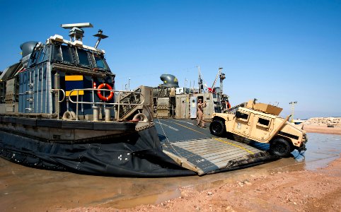 Flickr - Official U.S. Navy Imagery - A Sailor directs a Humvee as it debarks a landing craft air cushion.