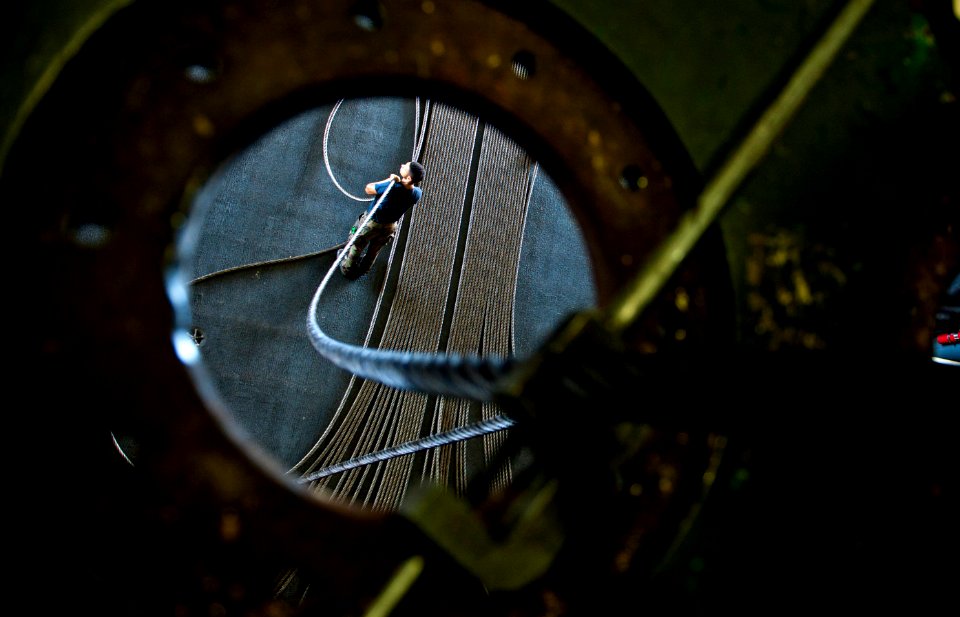 Flickr - Official U.S. Navy Imagery - A Sailor works with an arresting cable.