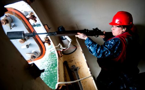 Flickr - Official U.S. Navy Imagery - A Sailor fires the messenger line.