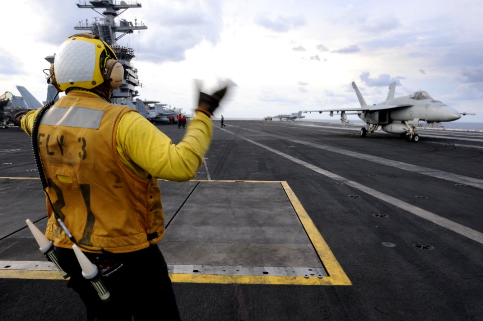 Flickr - Official U.S. Navy Imagery - A Sailor directs an F-A-18E Super Hornet. (1)