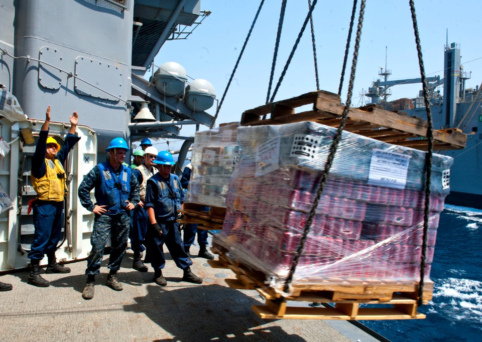 Flickr - Official U.S. Navy Imagery - A Sailor guides a pallet of supplies.