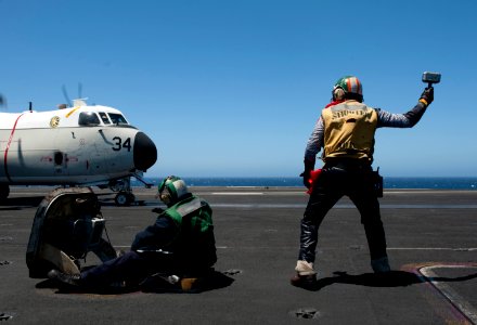 Flickr - Official U.S. Navy Imagery - A Sailor is dressed as comic-book hero Thor as he signals the final fixed-wing launch aboard USS Carl Vinson.