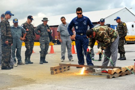 Flickr - Official U.S. Navy Imagery - A U.S. Navy diver observes a Guatemalan diver cutting metal.