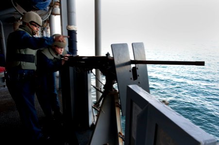 Flickr - Official U.S. Navy Imagery - A Sailor instructs during a .50-caliber machine gun qualification.