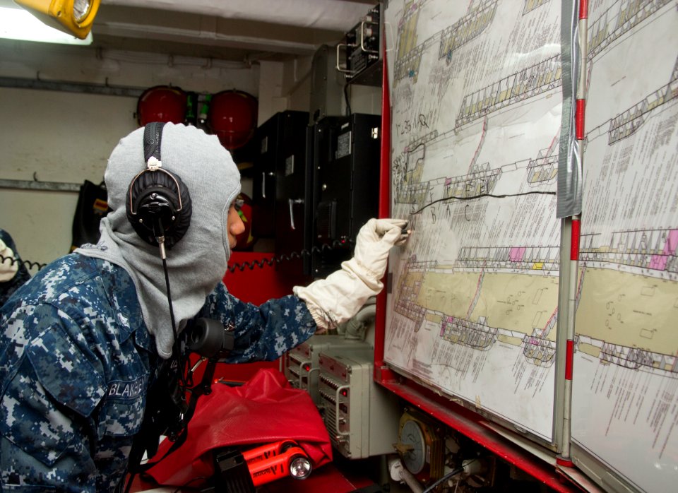 Flickr - Official U.S. Navy Imagery - A Sailor marks a diagram during a drill.