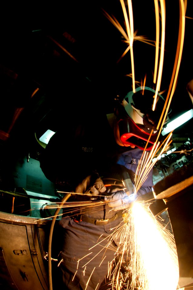 Flickr - Official U.S. Navy Imagery - A Sailor operates a plasma cutter.