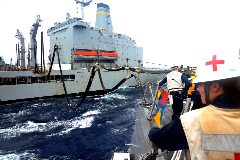 Flickr - Official U.S. Navy Imagery - A Sailor looks on as a refueling probe pumps fuel into the ship during a replenishment at sea.