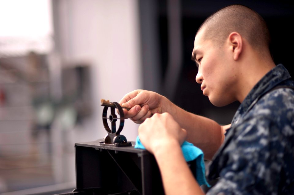 Flickr - Official U.S. Navy Imagery - A Sailor performs maintenance on a machine gun.