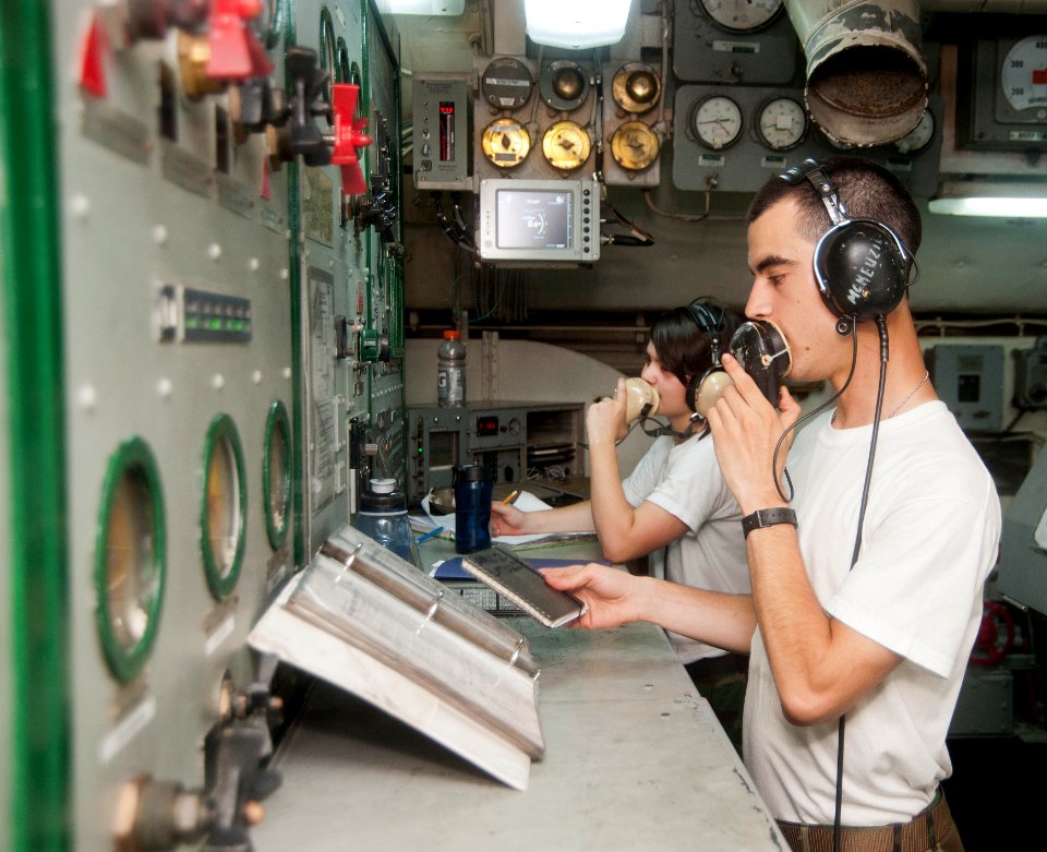 Flickr - Official U.S. Navy Imagery - A Sailor monitor communications and catapult operations.