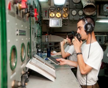 Flickr - Official U.S. Navy Imagery - A Sailor monitor communications and catapult operations.