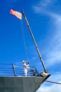 Flickr - Official U.S. Navy Imagery - A Sailor readies to haul down the U.S. Navy Jack.