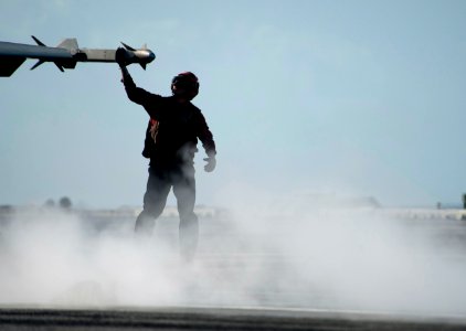 Flickr - Official U.S. Navy Imagery - An Aviation Ordnanceman checks ordnance on the wingtip of an F-A-18C Hornet