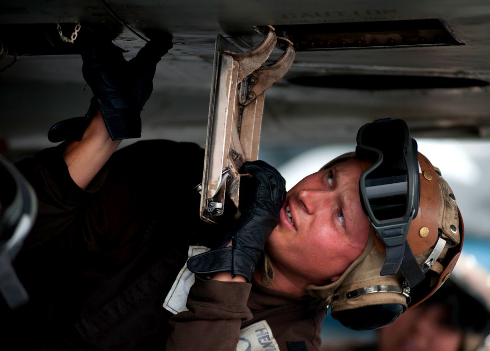Flickr - Official U.S. Navy Imagery - A Sailor performs maintenance on an F-A-18C