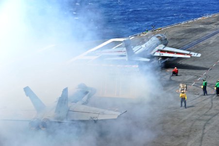 Flickr - Official U.S. Navy Imagery - An E-A-6B Prowler pours smoke from its exhaust as it prepares to launch.