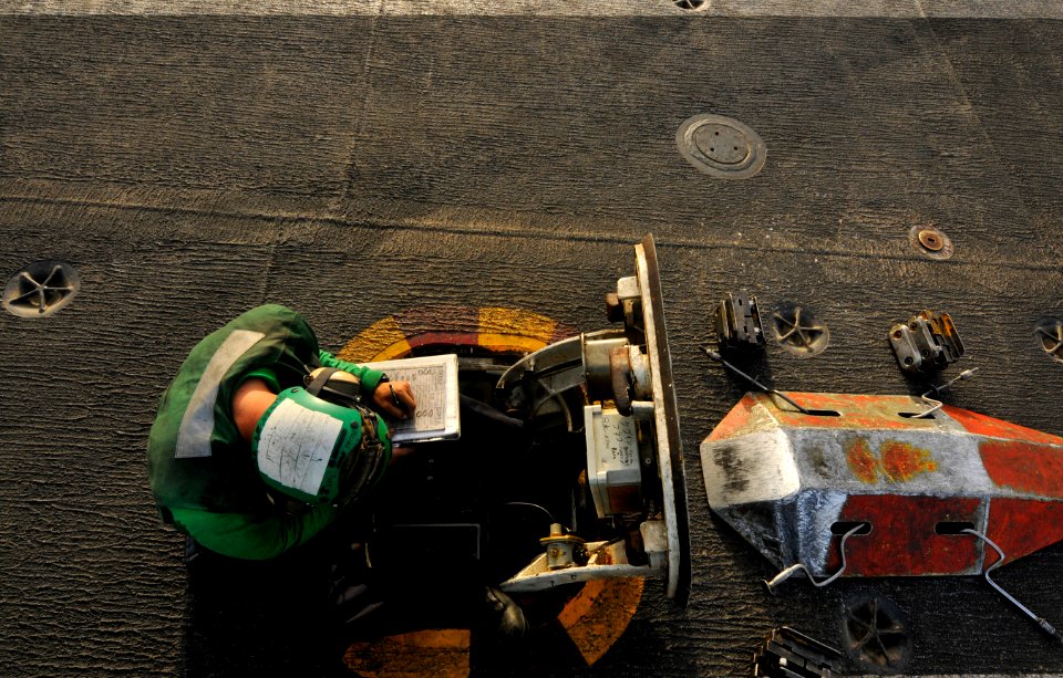 Flickr - Official U.S. Navy Imagery - A Sailor prepares the waist catapults to launch aircraft. (1)