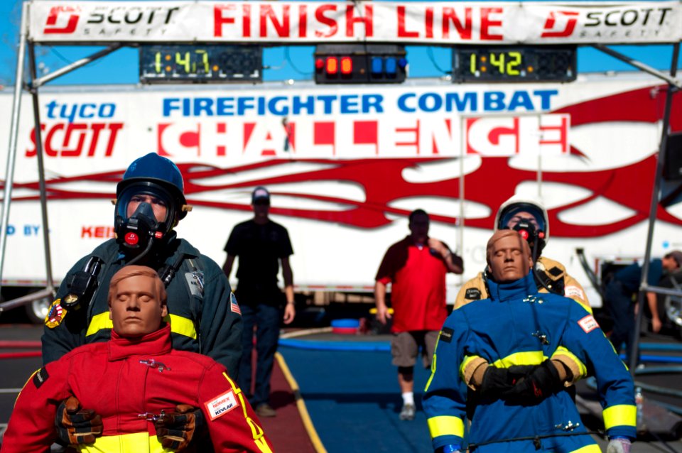 Flickr - Official U.S. Navy Imagery - A Sailor pulls a dummy during a safety challenge.