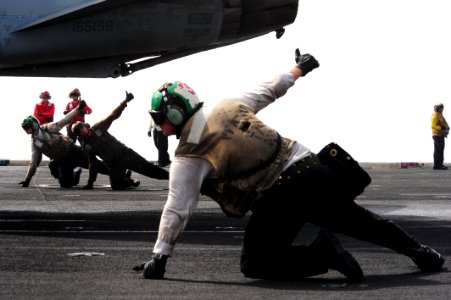 Flickr - Official U.S. Navy Imagery - A Sailor signals ready to launch. (1)