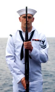 Flickr - Official U.S. Navy Imagery - A Sailor renders honors during a burial at sea ceremony.