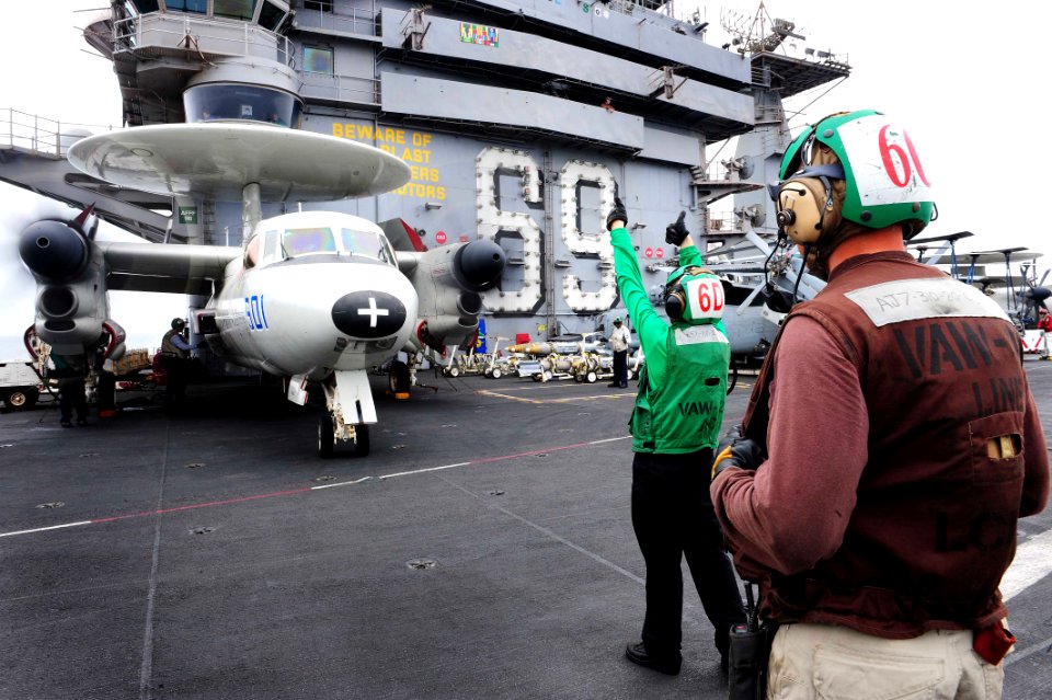 Flickr - Official U.S. Navy Imagery - A Sailor signals to the cockpit.
