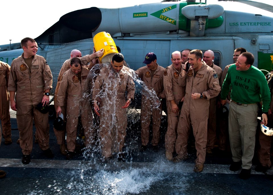 Flickr - Official U.S. Navy Imagery - An outgoing CO is doused with water by pilots from his squadron following an airborne change of command ceremony.
