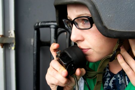 Flickr - Official U.S. Navy Imagery - A Sailor uses a sound powered phone to communicate with the bridge during a man overboard drill.
