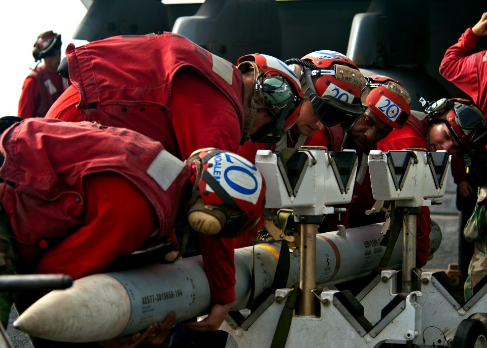 Flickr - Official U.S. Navy Imagery - Aviation ordnancemen move ordnance on the flight deck.