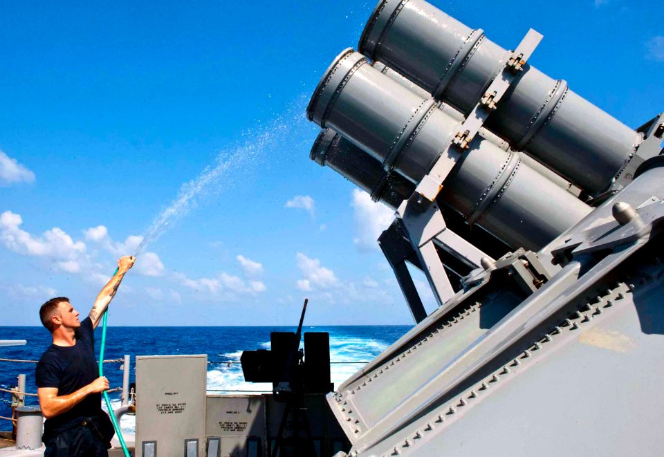 Flickr - Official U.S. Navy Imagery - A Sailor washes the MK-141 Harpoon missile launchers.