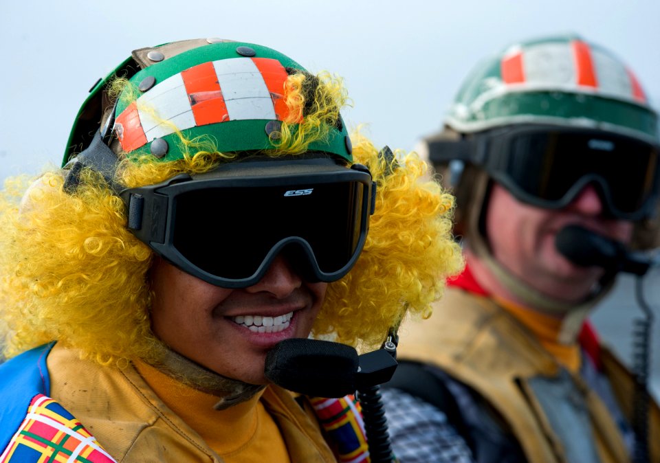 Flickr - Official U.S. Navy Imagery - A Sailor wears a clown suit while launching aircraft. (1)