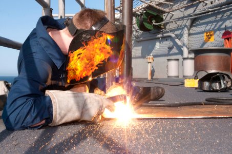 Flickr - Official U.S. Navy Imagery - A Sailor welds together a table.