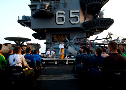 Flickr - Official U.S. Navy Imagery - Cmdr. John Owen speaks to Sailors during Easter church services.