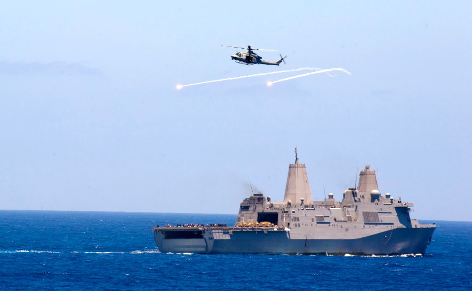 Flickr - Official U.S. Navy Imagery - A UH-1Y Huey helicopter releases flairs during an air power demonstration for Tiger Cruise participants.