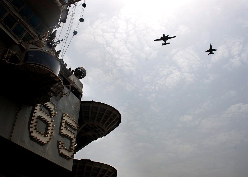 Flickr - Official U.S. Navy Imagery - CO's fly above USS Enterprise.