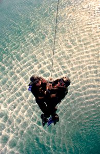 Flickr - Official U.S. Navy Imagery - Explosive ordnance disposal Sailors are lifted from water.