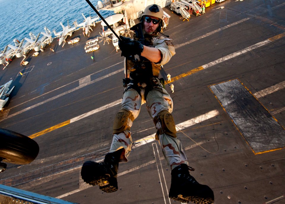 Flickr - Official U.S. Navy Imagery - An Explosive Ordnance Disposal Technician rappels from an MH-60S Sea Hawk helicopter.