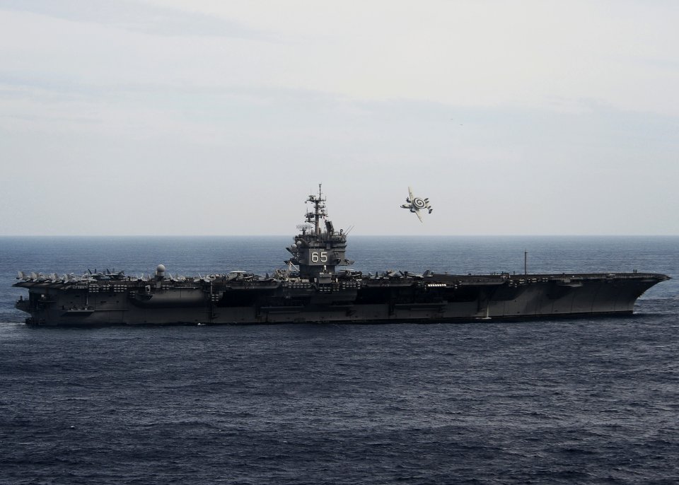 Flickr - Official U.S. Navy Imagery - An E-2C flies above USS Enterprise.