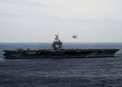 Flickr - Official U.S. Navy Imagery - An E-2C flies above USS Enterprise.