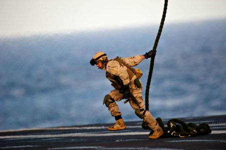Flickr - Official U.S. Navy Imagery - An explosive ordnance disposal technician demonstrates fast roping.