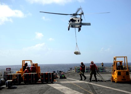 Flickr - Official U.S. Navy Imagery - An MH-60S carries ammunition from USS Enterprise.