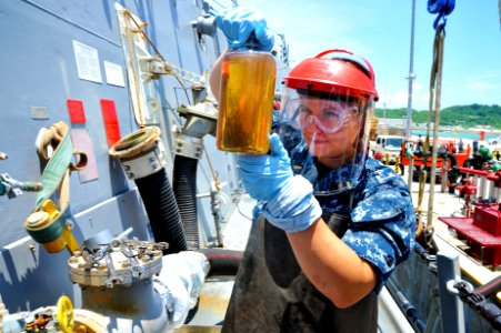 Flickr - Official U.S. Navy Imagery - An officer examines an oil sample.