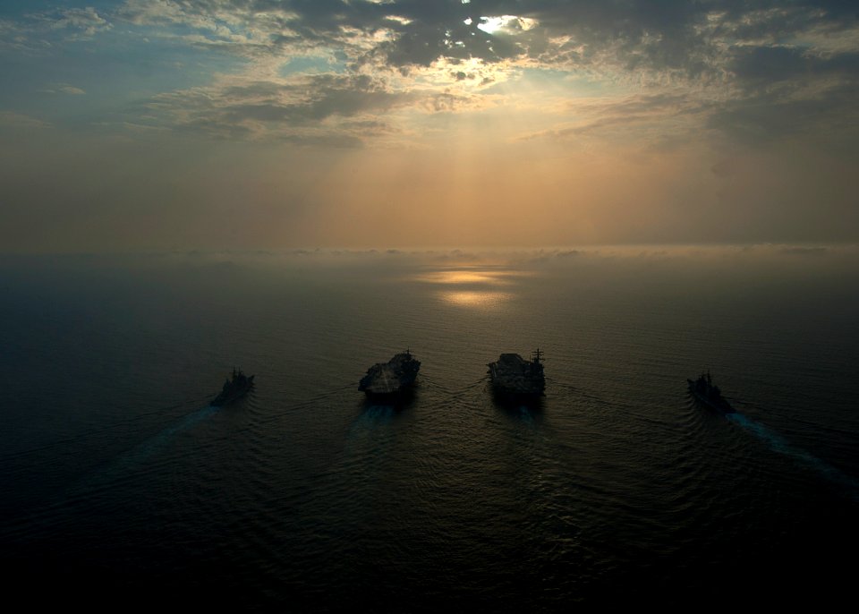 Flickr - Official U.S. Navy Imagery - Four Navy ships underway at sunrise.