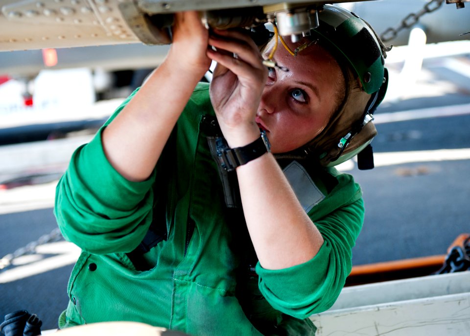 Flickr - Official U.S. Navy Imagery - Aviation Electronics Technician Airman Christina McCallum replaces a part on an MH-60R Sea Hawk aboard USS John C. Stennis (CVN 74).