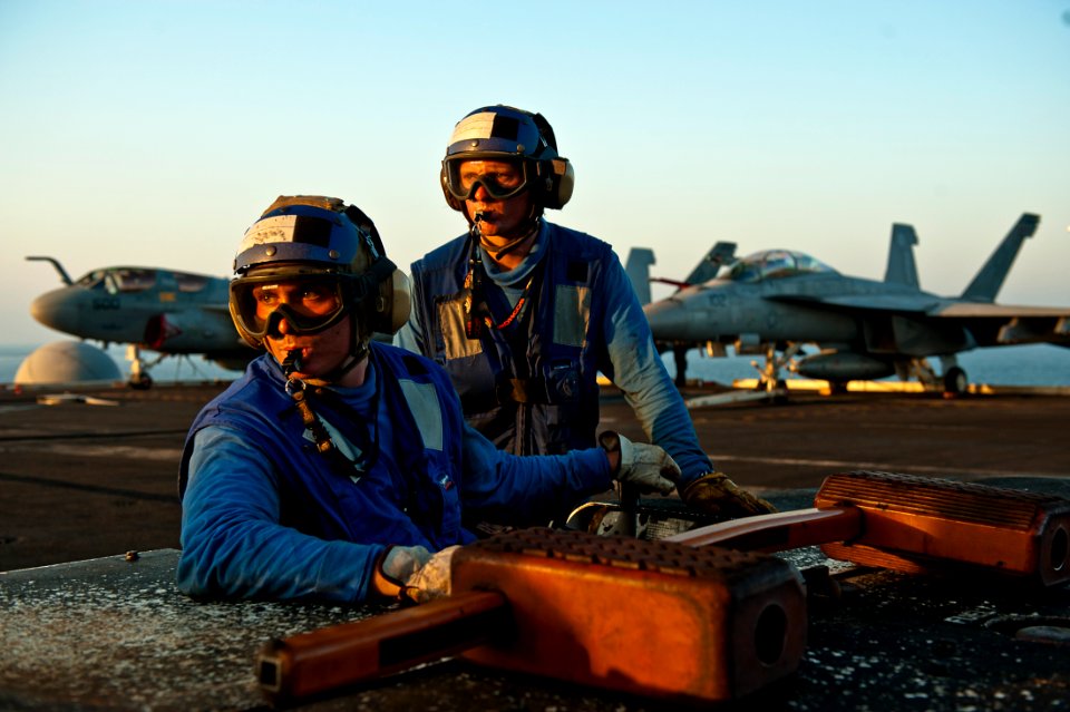 Flickr - Official U.S. Navy Imagery - Aviation Boatswain’s Mate (Handling) Airman Ethan Williams positions an E-2C Hawkeye.