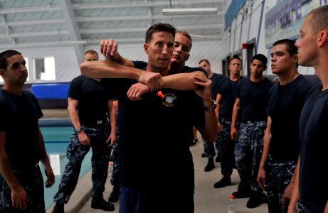 Flickr - Official U.S. Navy Imagery - An instructor demonstrates escape and release techniques.