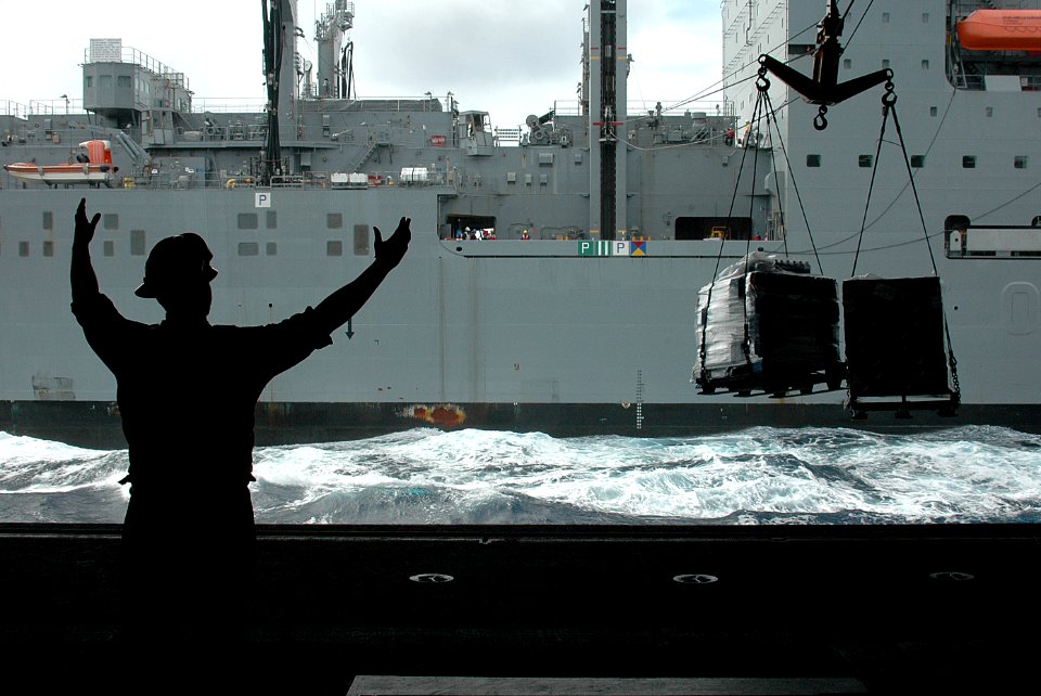 Flickr - Official U.S. Navy Imagery - Boatswain's Mate 3rd Class Donte Ruffin signals.