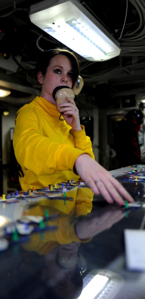 Flickr - Official U.S. Navy Imagery - Calif. native-Sailor moves an aircraft template on the Ouija board in flight deck control aboard USS John C. Stennis