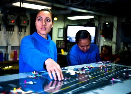 Flickr - Official U.S. Navy Imagery - Aviation Boatswain’s Mate (Handling) Airman Jaqueline Casanova moves aircraft across the Ouija board in flight deck control aboard USS John C. Stennis (CVN 74).