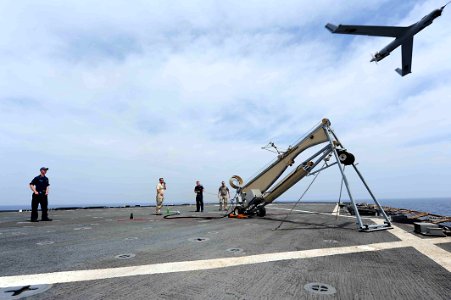 Flickr - Official U.S. Navy Imagery - Civilian contractors from Insitu, Inc., launch a Scan Eagle unmanned aerial vehicle.