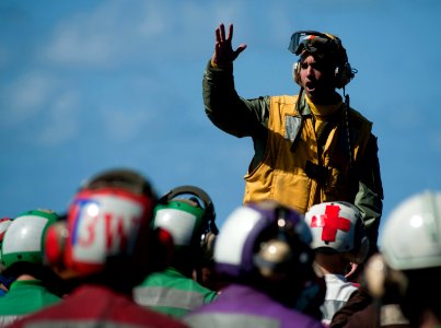 Flickr - Official U.S. Navy Imagery - Lt. j.g. Alexey Diaz briefs flight deck personnel before a mass casualty drill